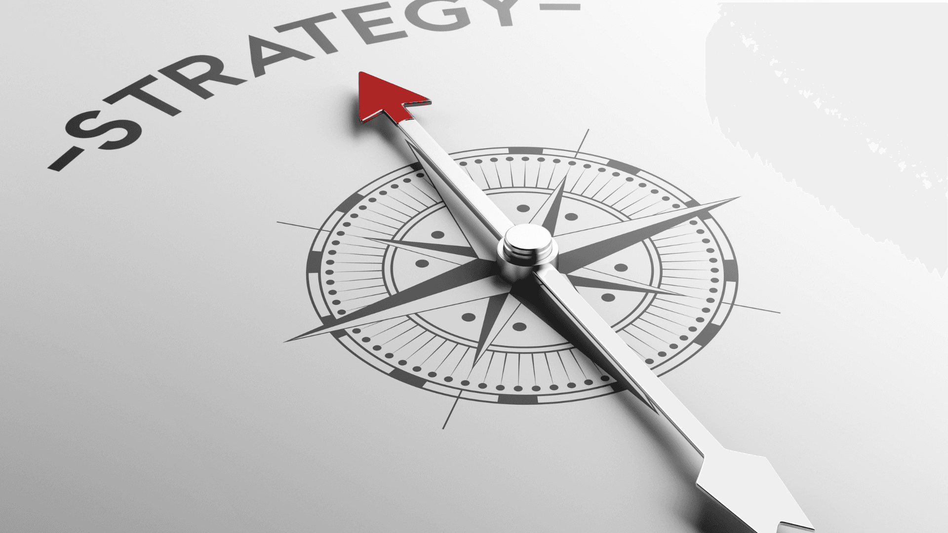 A compass with its needle pointing toward strategy